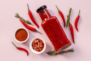Spicy chili seasoning and red ripe pepper, top view