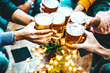 Fototapeta Group of people drinking beer at brewery pub restaurant - Happy friends enjoying happy hour sitting at bar table - Closeup image of brew glasses - Food and beverage lifestyle concept obraz