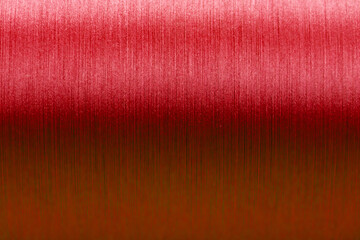 Closed up of red color of thread textured background (Focus at center of picture)