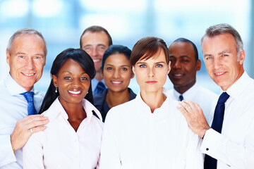 Multi ethnic business people posing for a photograph. Group of multi ethnic business people posing for a photograph.