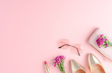 Set of women’s outfit with golden high heels. Top view