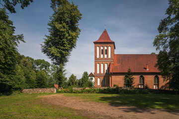 Gothic church in village Kuty, Masuria, Poland - 578351696