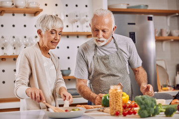 happy and healthy seniors prepare vegan food at home
