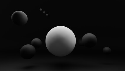 3d render of black sphere and one white on dark background