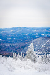 Fototapeta na wymiar snow-capped blue mountains, ski resort