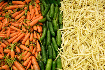 Fresh different vegetables, carrot, cucumber, bean on market as background. Organic texture. Local food and vegetables. Agriculture. Top view.