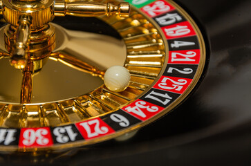 The roulette wheel in the casino is spinning