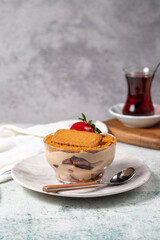 Homemade Strawberry Custard Pudding. Biscuit and strawberry dessert. Turkish magnolia dessert in glass bowl
