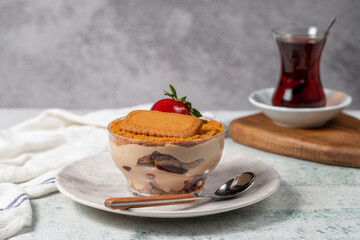 Homemade Strawberry Custard Pudding. Biscuit and strawberry dessert. Turkish magnolia dessert in glass bowl