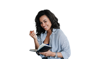 Cheerful African American girl in casual clothes holds diary and pen using laptop looks at camera planning agenda. Happy Brazilian young woman remote works against transparent background. Student