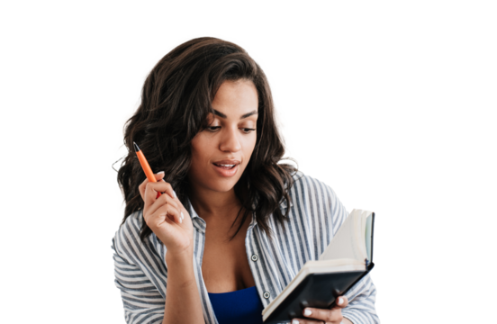 Focused African American girl in casual against transparent background holds pen reads note in diary checking agenda. Successful cosmetologist looks at clients list for today. Purposeful student