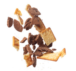 Mixed Cracker Butter Cookie Chocolate chip fall fly in mid air, cookie cracker floating. Mixed Cracker Butter Cookie Chocolate chip crack crunch throw in air. White background isolated freeze motion