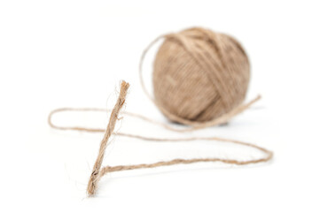 String of twine close up and blurred twine ball