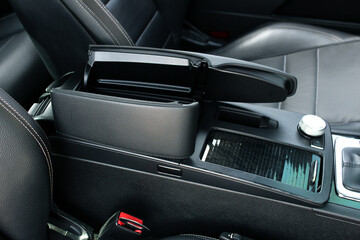 Fototapeta na wymiar Luxury leather interior sport car. Sport car interior. Sport car armrest open. Luxury car armrest open.