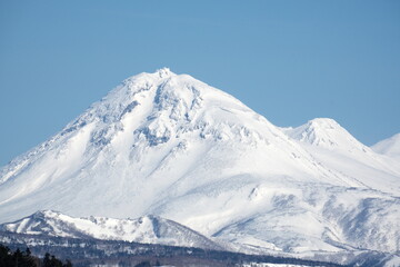 Fototapeta na wymiar Hokkaido Shiretoko World Heritage Site Mt. Rausu in winter