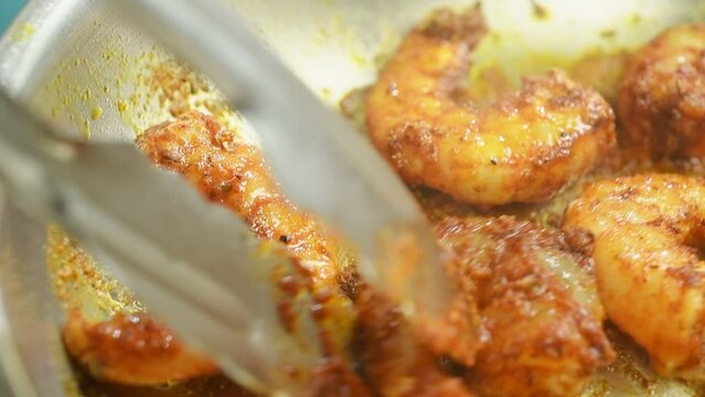 Cooking shrimps in the frying pan.
