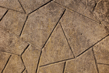 Obraz premium Texture of designer concrete facade with triangles.
