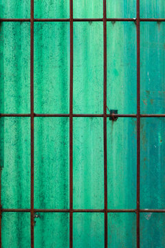 Iron arranged in the form of a rectangular column with a green background
