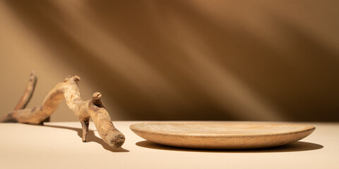 Wood flat plate mockup and shadows on the wall. Background for food products cosmetics or jewelry. Front view..