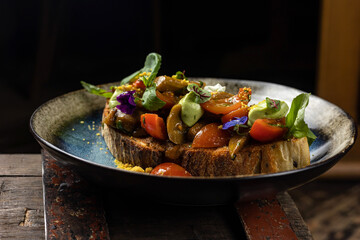 delicious vegetarian bruschetta with cheese, tomatoes, greens, avocado 

