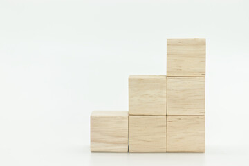 wooden blank block cubes arranged in staircase shape on white background.