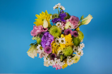 Beautiful colourful summer bouquet on blue background