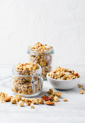 Granola with Nut Mix on Bright Concrete Background, Healthy Vegan Snack or Breakfast