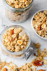 Granola with Nut Mix on Bright Concrete Background, Healthy Vegan Snack or Breakfast