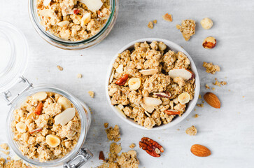 Granola with Nut Mix on Bright Concrete Background, Healthy Vegan Snack or Breakfast