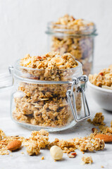 Granola with Nut Mix on Bright Concrete Background, Healthy Vegan Snack or Breakfast