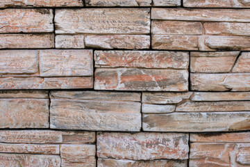 beautiful stone wall, fragment of colored stones, natural stone, beautiful background