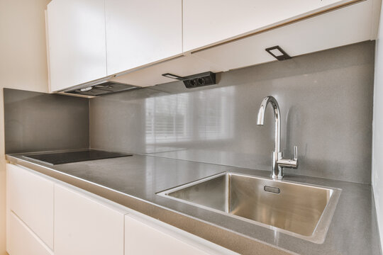 Kitchen counter with sink and stove