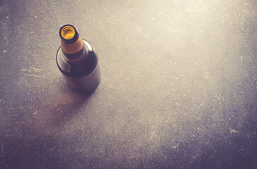 Beer bottle on dark table - 578382069