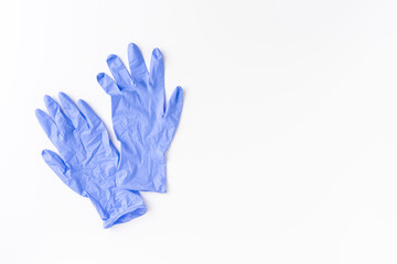 Blue disposable gloves on white background. Top view