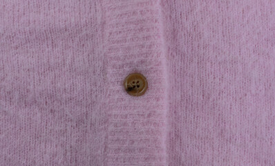 Pink mohair and alpaca wool from a cardigan as background