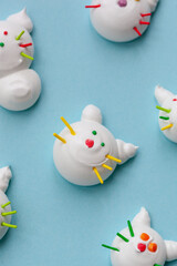 handmade delicious meringue in the form of funny cats of different colors