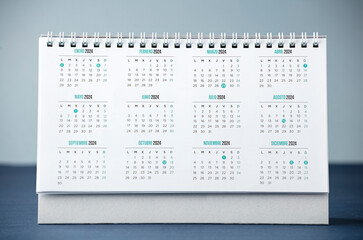 desk calendar with year 2024 and days, blue desk