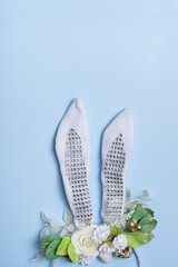 Easter flat lay. Creative composition with bunny ears and flowers, easter eggs top view