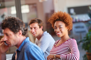 Proud to be a part of an amazing team. Portrait of a group of young colleagues in a meeting together.