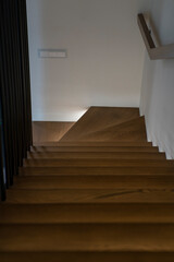 Fototapeta premium Illuminated staircase to the second floor