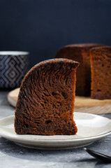 Baba Neagra, Black Baba, Traditional Moldavian Dessert on Dark Background