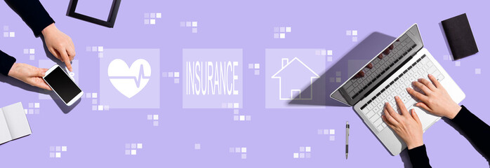Fototapeta na wymiar Insurance concept with two people working together