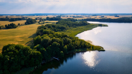 Fototapeta na wymiar This stunning drone panorama captures a lake in Poland's Lubuskie Voivodeship on a bright and sunny spring day