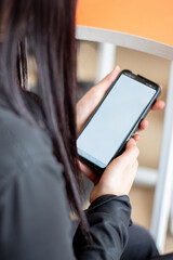 people holding cell phone and tablet