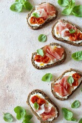 Healthy snack. Sandwiches with wholemeal bread, ham and cheese. Top view.