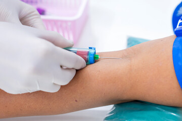 Nurse collecting a blood from patient in hospital