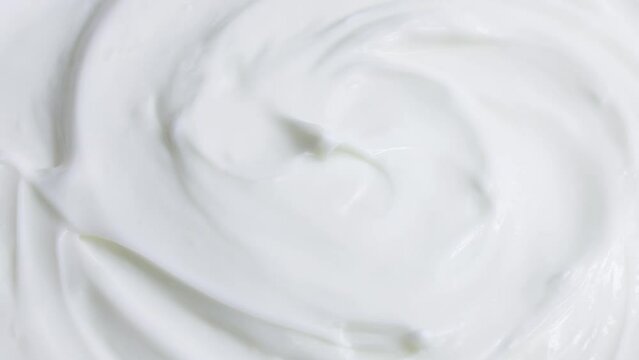 White smooth creamy moisturizing face cream texture rotation close up