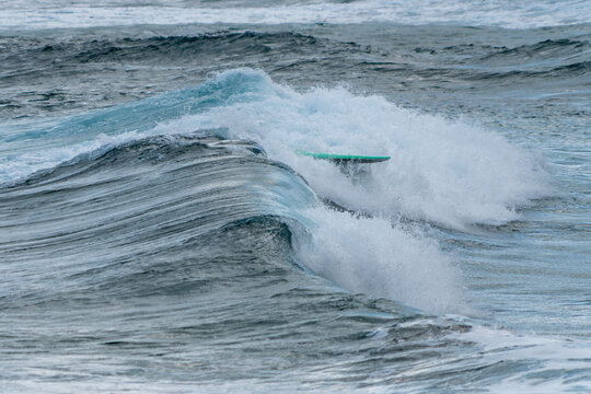 surfing on the beach of la cicer in Las Plamas de GRan Canaria