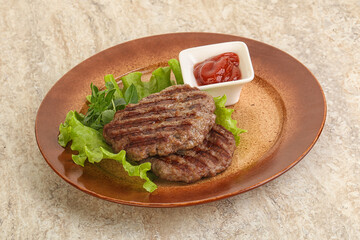 Grilled beef burger cutlet with sauce