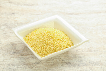 Raw couscous in the bowl